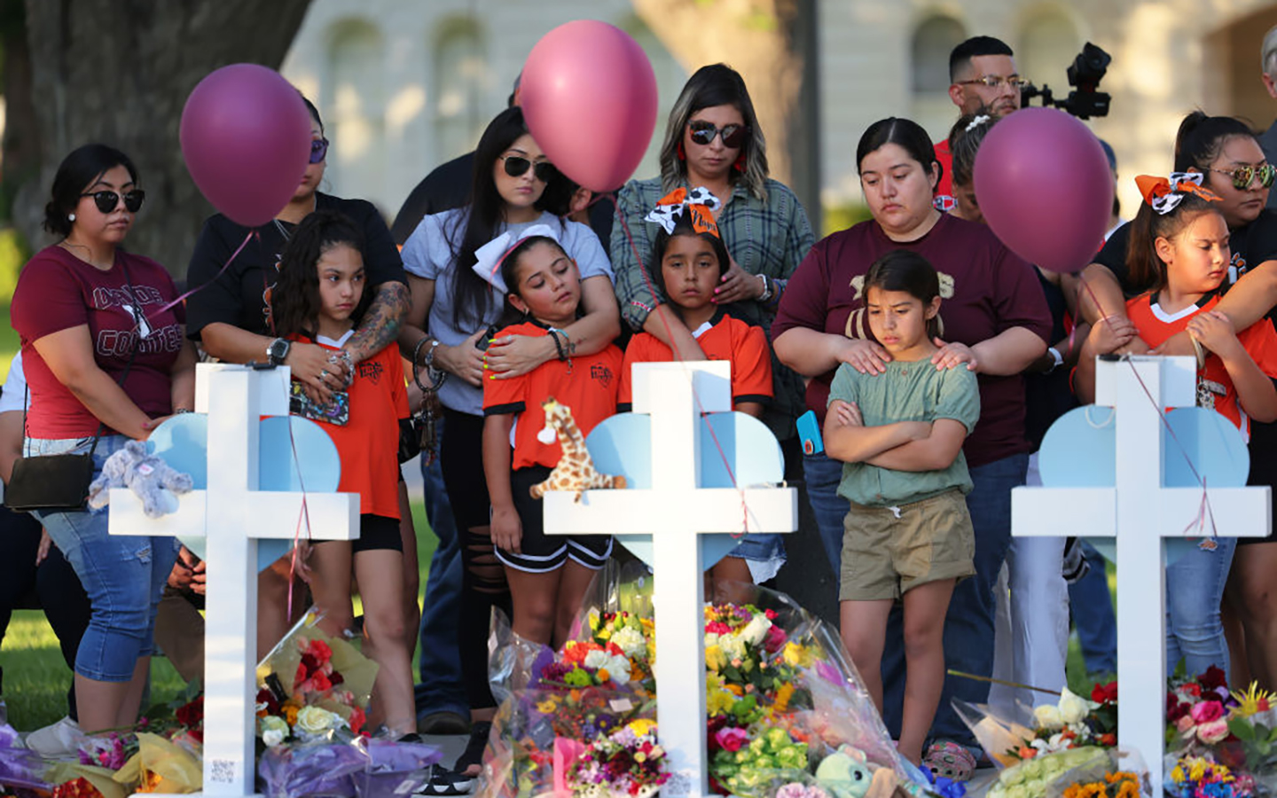 young children and their families mourn victims of Uvalde shooting outside of Rob Elementary