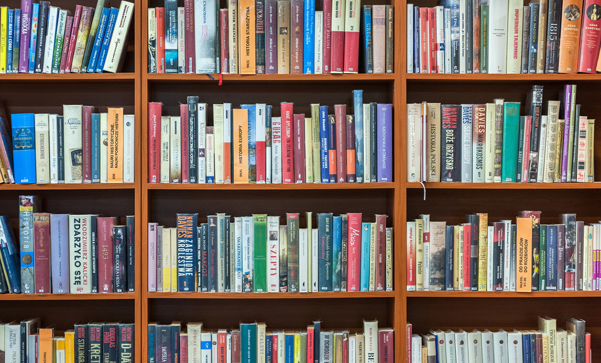 a photo of a bookshelf in a school library