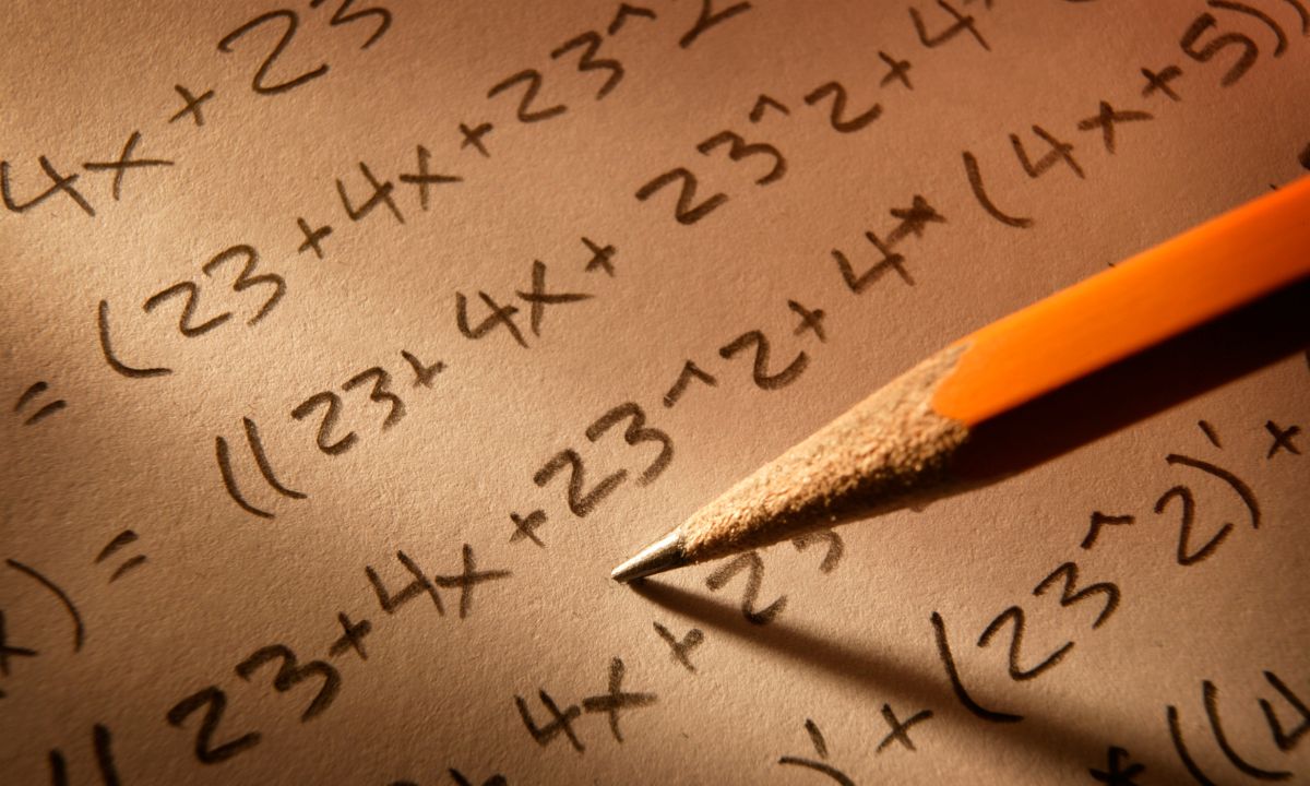 a photo of a pencil solving math equations