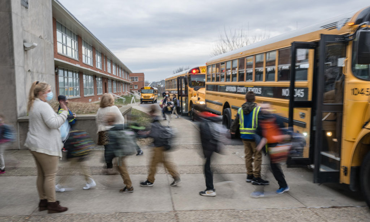 Students exit a school.