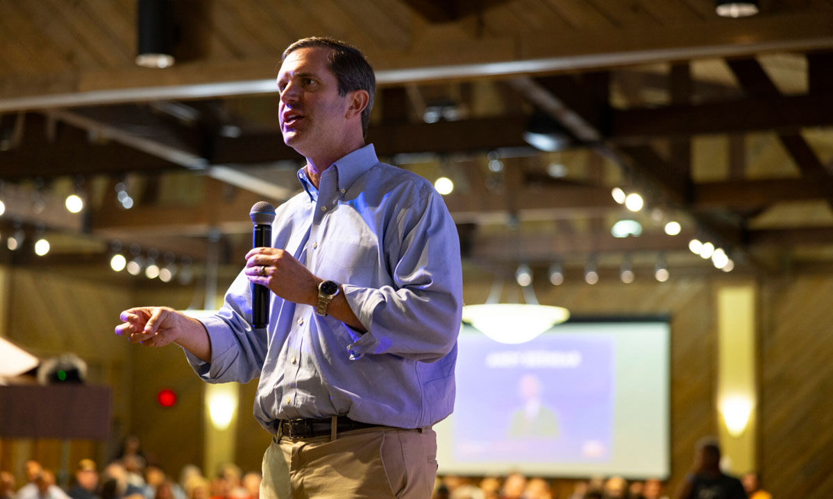 This is a photo of Gov. Andy Beshear speaking at a dinner.