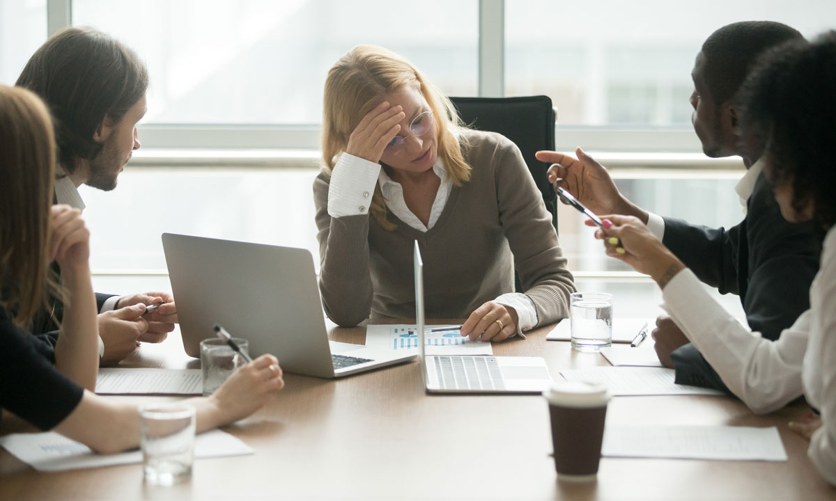 This photo shows a stressful work meeting.