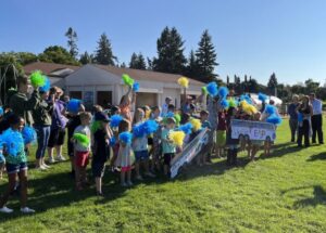 This is a photo of Children at the Lincoln Options Elementary School camp cheer.