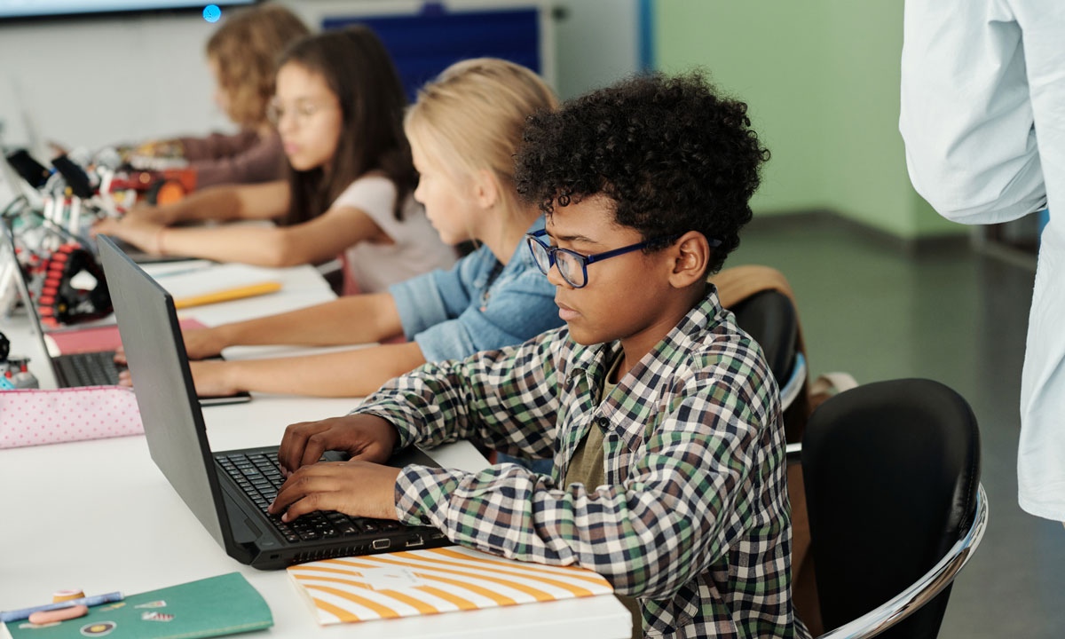 This is a photo of school children on laptops.