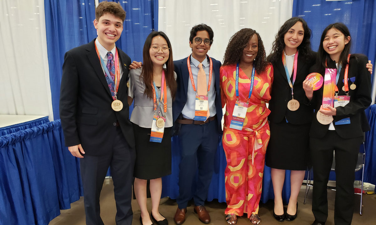 The author with Jericho High School participants in the 2023 Regeneron International Science and Engineering Fair in Dallas.