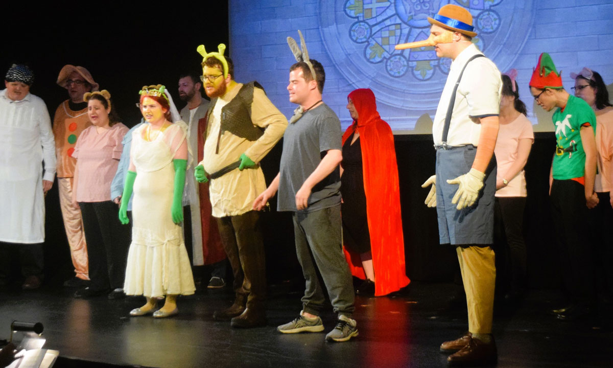 This is a photo of member sof the POINT residential community performing a production of "Shrek."