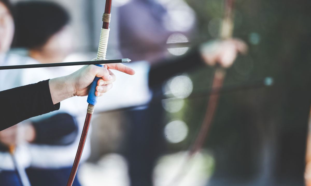 This is a photo of someone holding a bow and arrow.