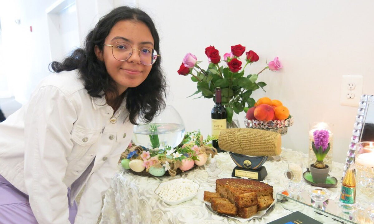 Pourochista Izadyar, a high school freshman, explained Zoroastrian symbols and typical New Year delicacies to teachers taking the Religion Literacy for Educators summer course.