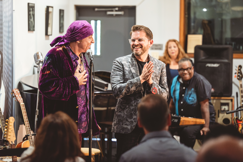 A photo of Stevie Van Zandt and TeachRock Executive Director Bill Carbone speaking at an event at Chess Records in Chicago