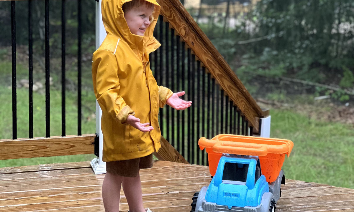 This is a photo of Megan Weber's son playing in the rain.