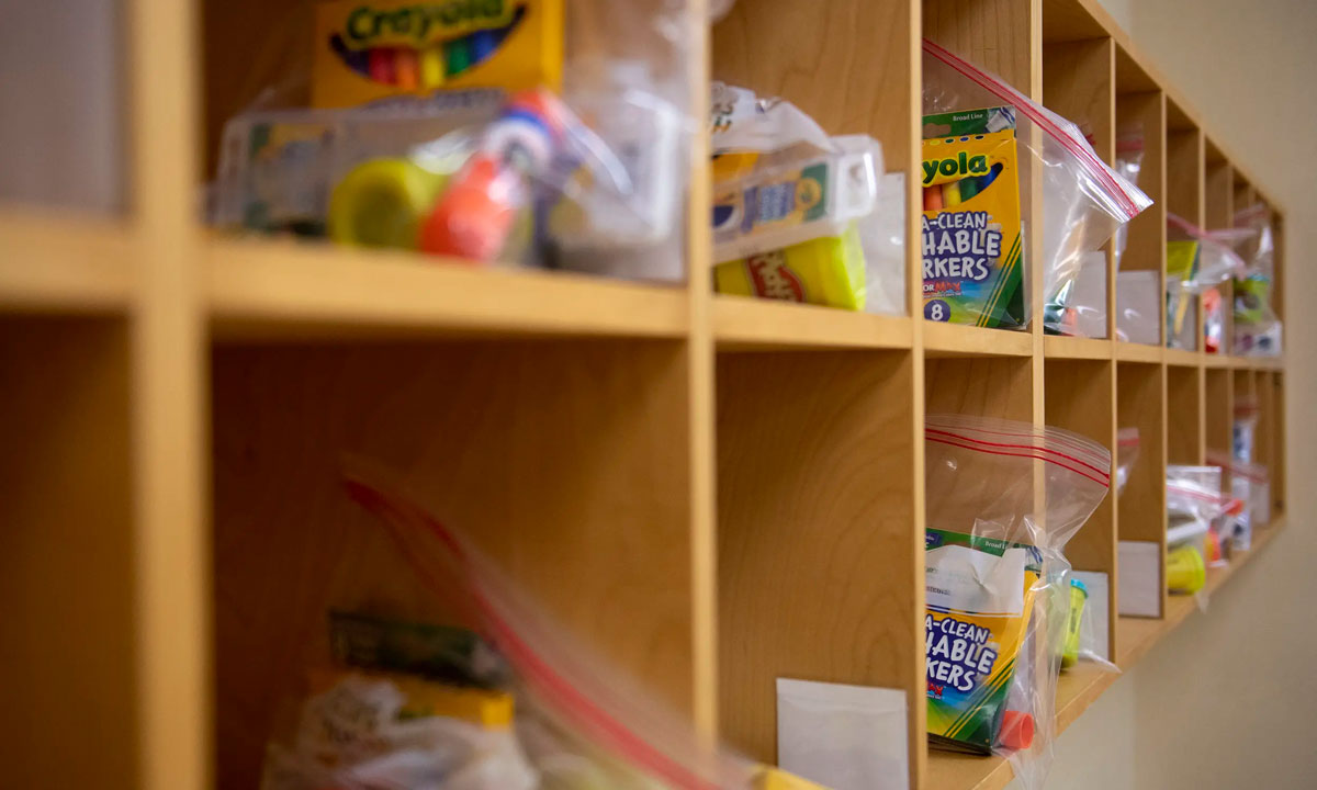 This is a photo of a cubby filled with school supplies.