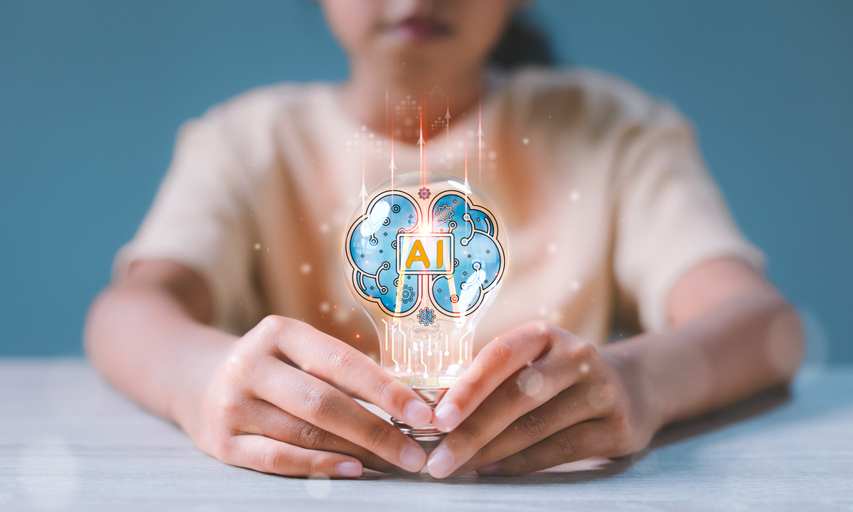 a stock photo of a student holding a lightbulb that says AI