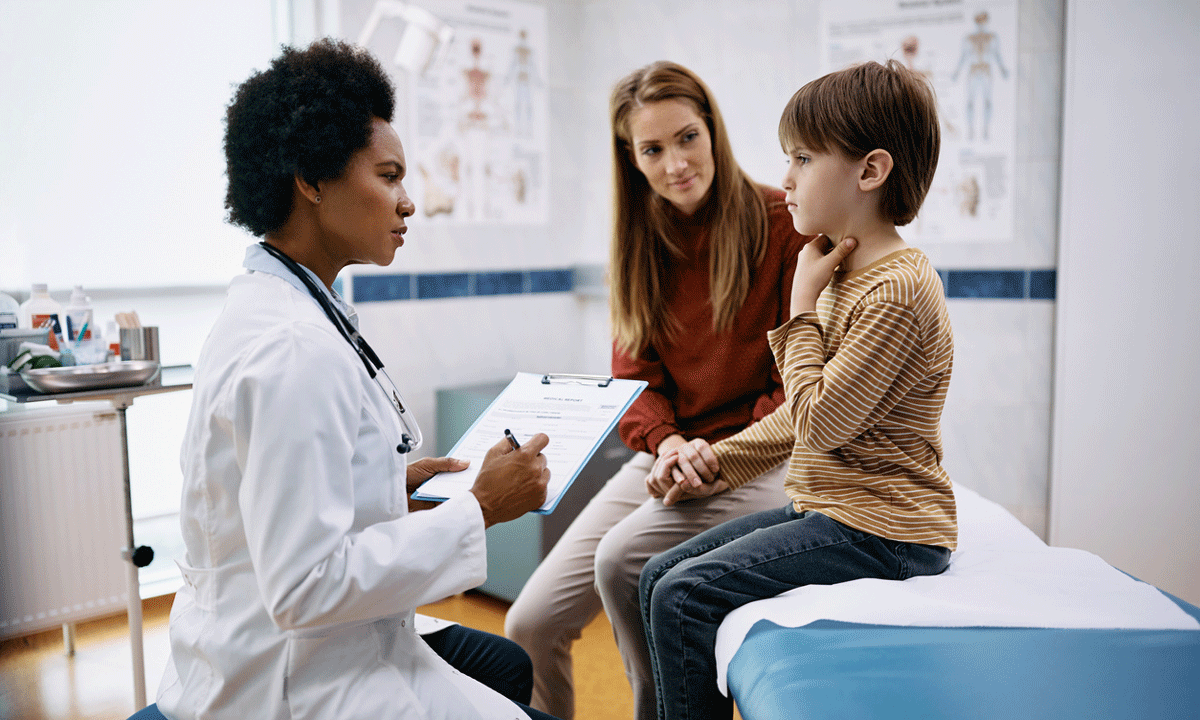 A child complaining of a sore throat during a doctor appointment