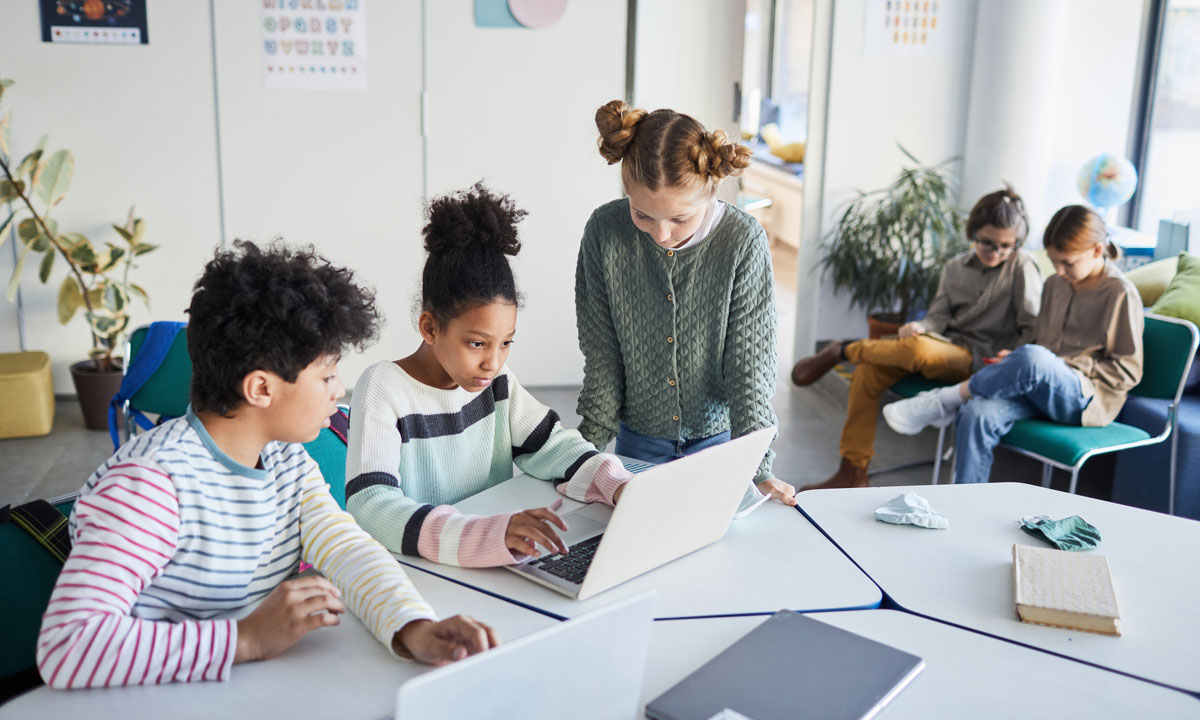 This is a photo of students working together in a classroom.