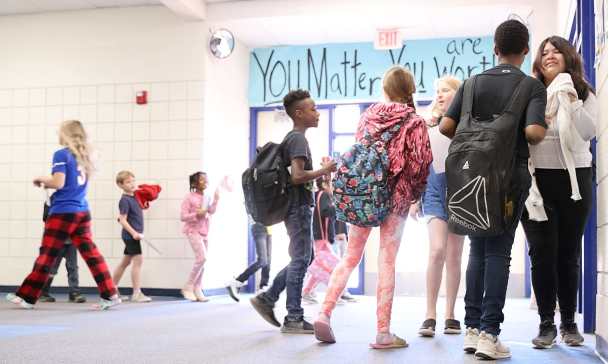 This is a photo of students walking in the hallway.