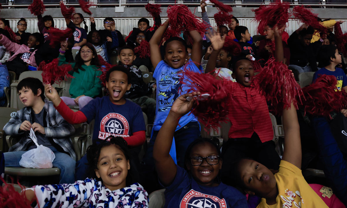 This is a photo of third grade students at an IUPUI basketball game.