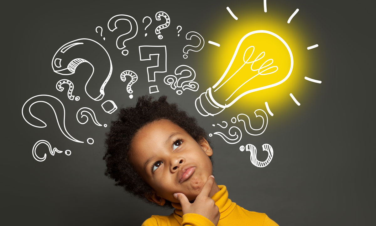 This is a photo of a student thinking with a lightbulb and question marks above their head.