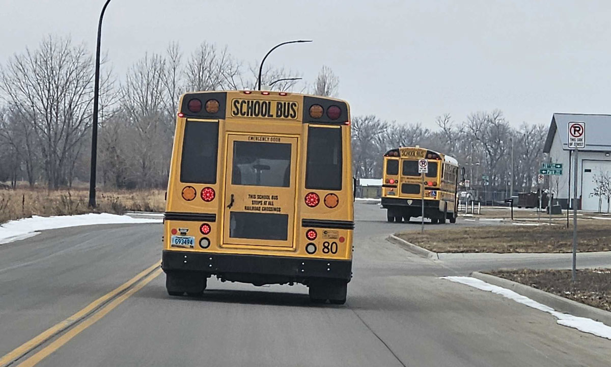 This is a photo of a school bus driving on the road.