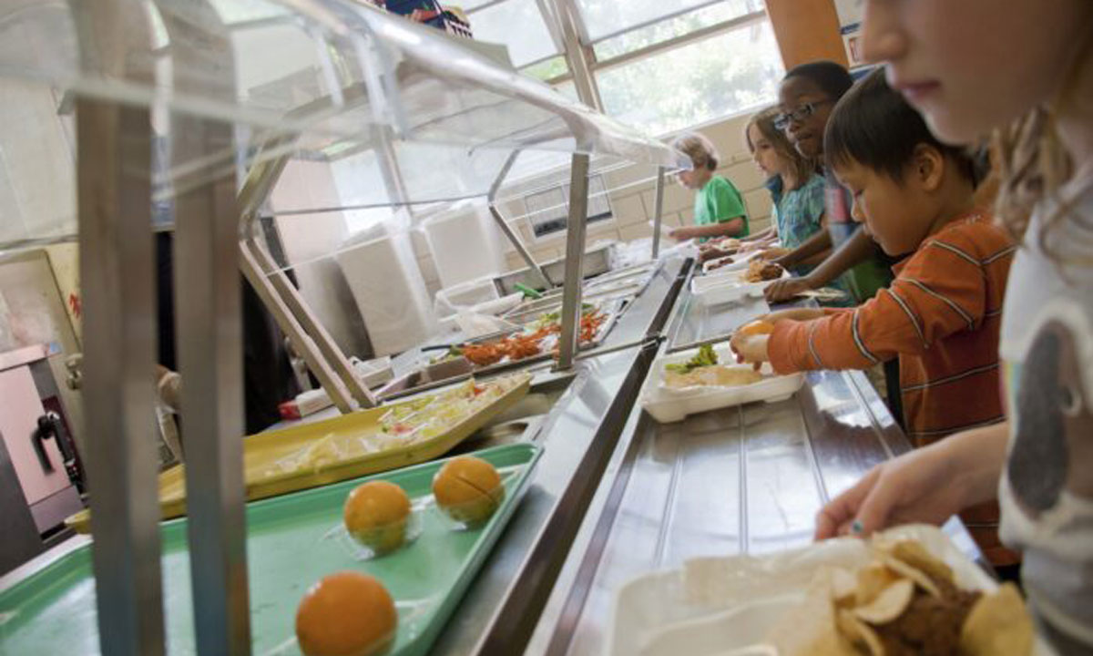 This is a photo of students standing in line for school lunch.