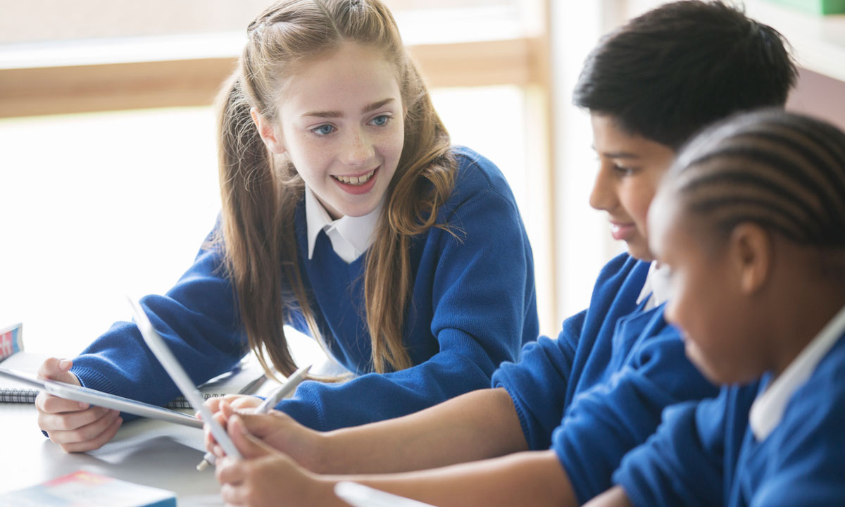 This is a photo of three students wearing school uniforms.