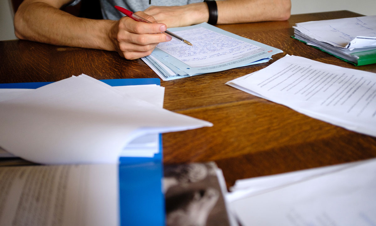 This is a photo of a teacher grading tests.