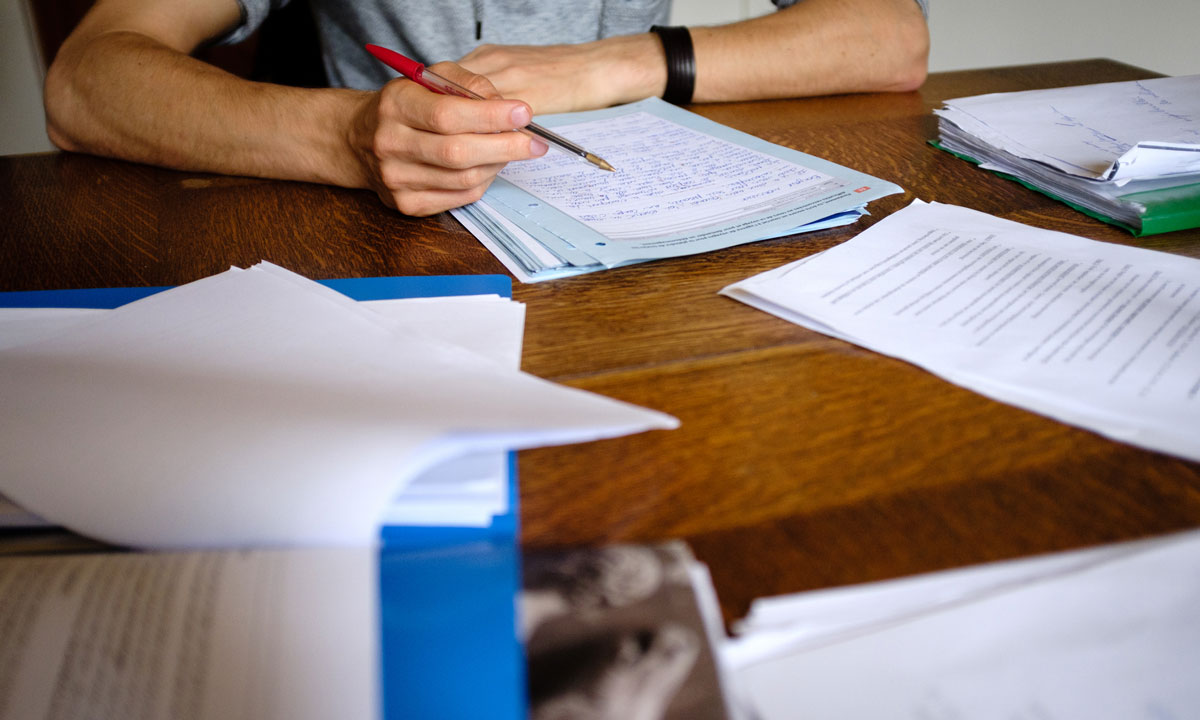 This is a photo of a teacher grading papers.