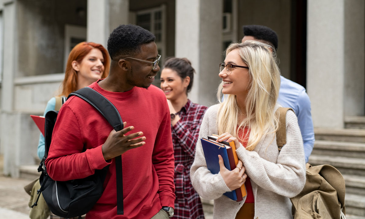 This is a photo of college students talking outside.