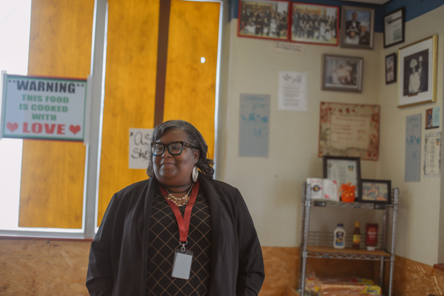 pine bluff teacher tykesha cross smiles at her great aunt in her family's farm and fish business 